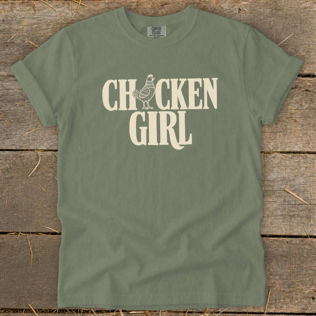 Olive t-shirt with "CHXXCKEN GIRL" text and chicken graphic.