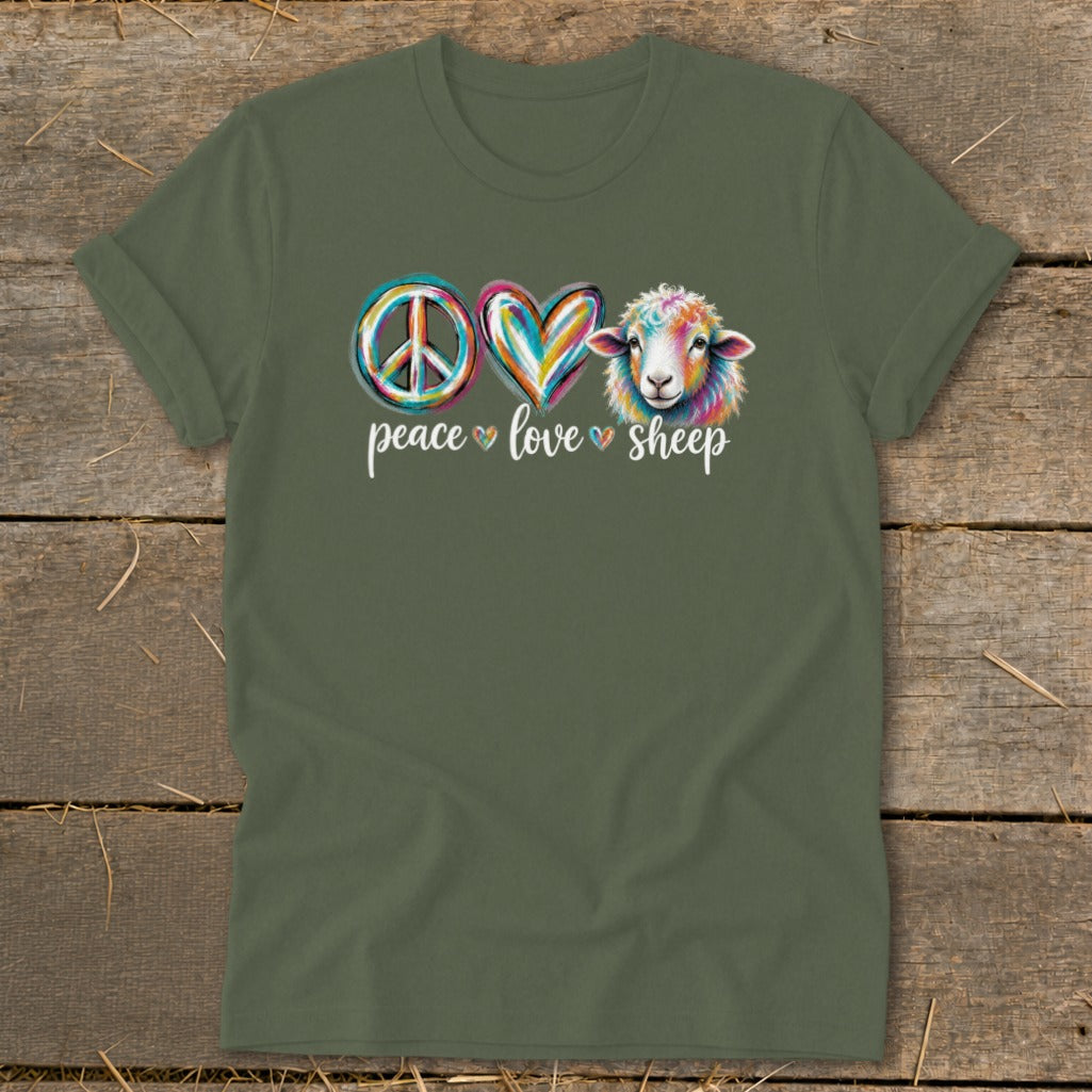 Green t-shirt with colorful peace sign, heart, and sheep graphic and text.