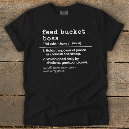 Black t-shirt with white text defining "feed bucket boss" and humorous farming sayings.