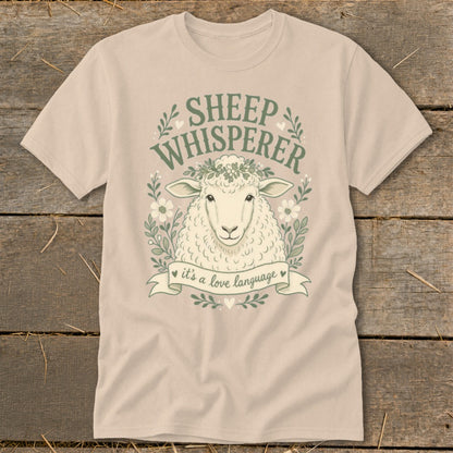 Tan t-shirt with sheep illustration and text "SHEEP WHISPERER it's a love language".