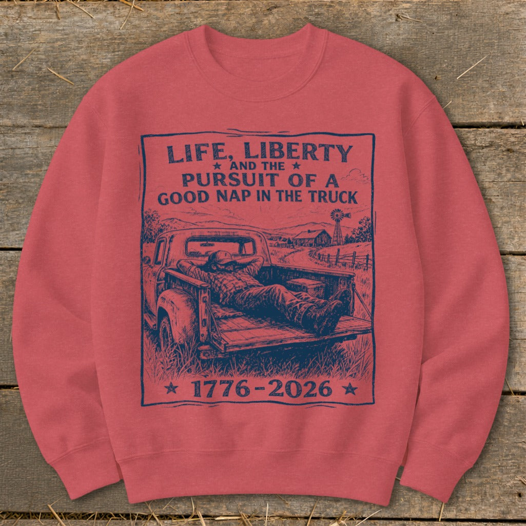 Graphic of man napping in truck bed with text "Life, Liberty and the Pursuit of a Good Nap in the Truck 1776-2026".