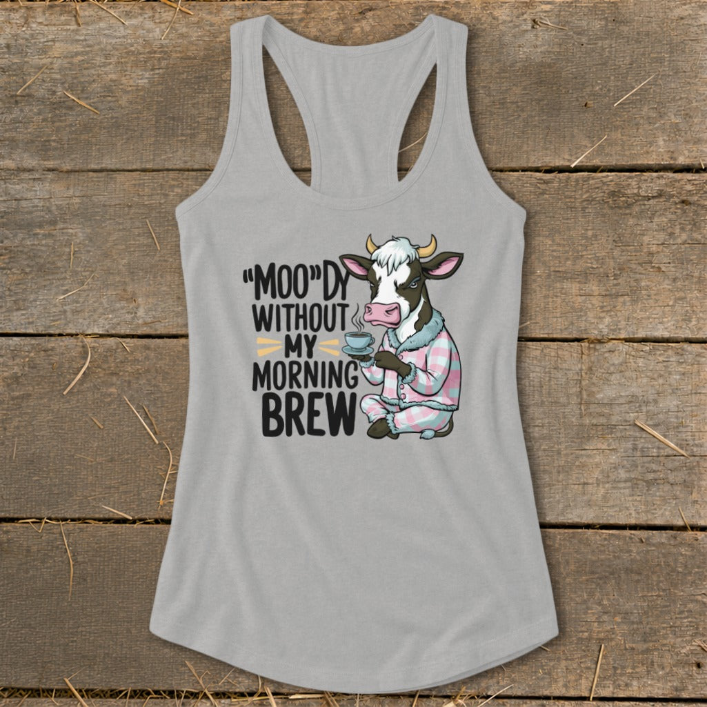 Graphic of cow in pajamas holding coffee, with text "Moo"dy Without My Morning Brew".