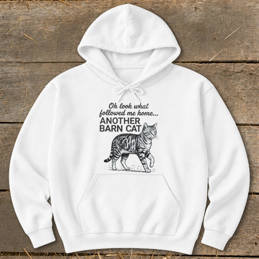 White hoodie with text "Oh look what followed me home... ANOTHER BARN CAT" and a tabby cat illustration.