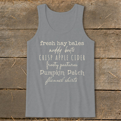 Gray tank top with text listing autumn-themed phrases.