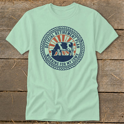 Mint t-shirt with circular graphic of a cow and "Official Retirement Plan Working For My Cows" text.