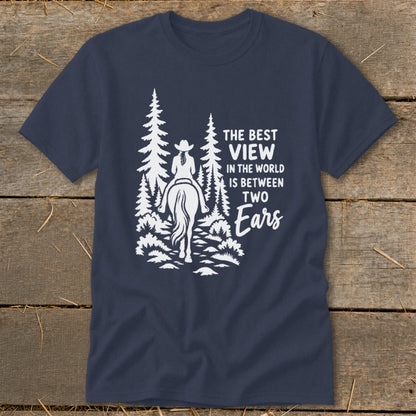 A navy blue t-shirt featuring a white graphic of a horseback rider and text reading The Best View In The World Is Between Two Ears.