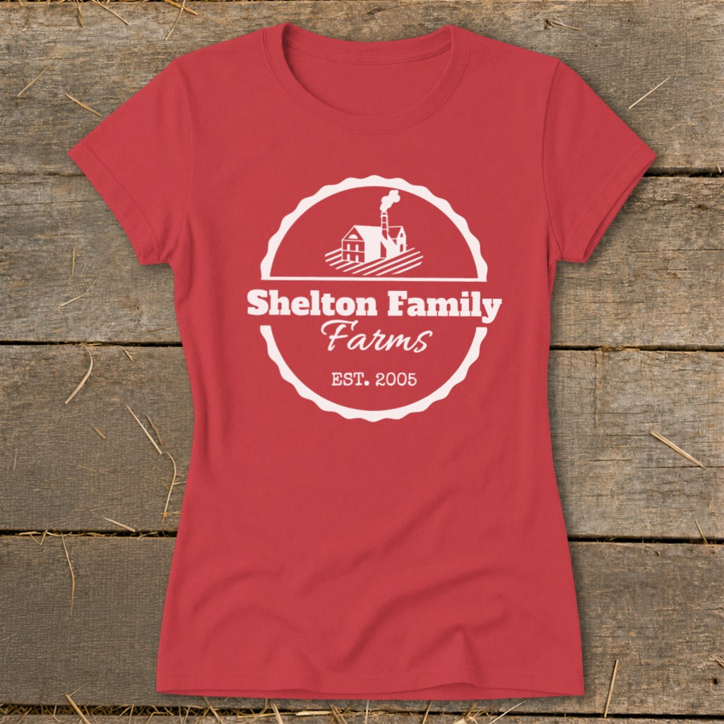 Red t-shirt with white Shelton Family Farms EST. 2005 logo and farm illustration.