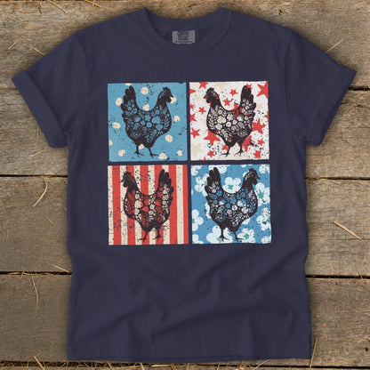 Four chickens in decorative boxes with patriotic backgrounds on a navy t-shirt.
