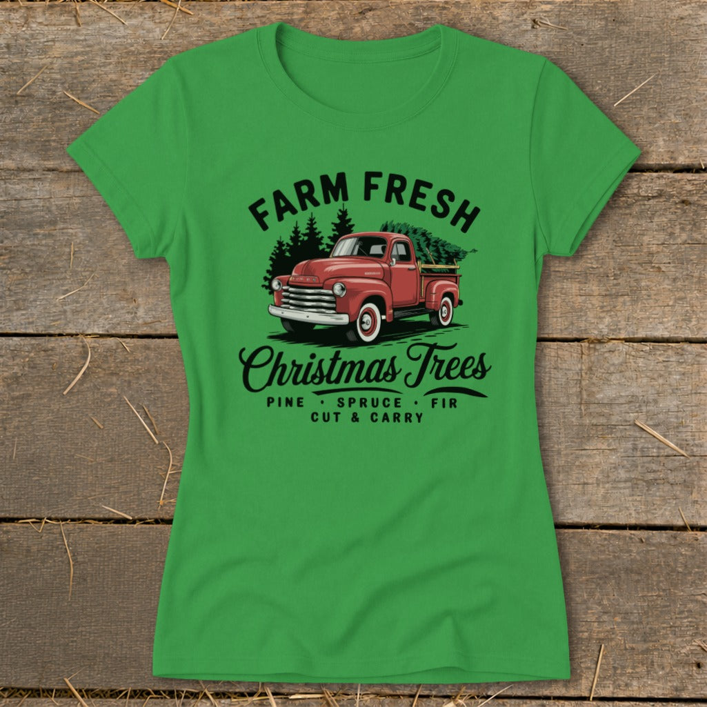 Green t-shirt with vintage red truck hauling Christmas trees, "Farm Fresh Christmas Trees" text.