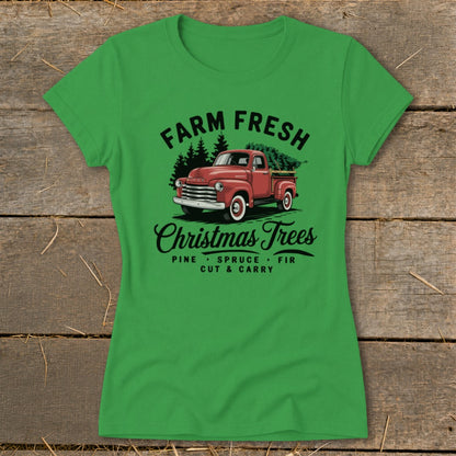 Green t-shirt with vintage red truck hauling Christmas trees, "Farm Fresh Christmas Trees" text.