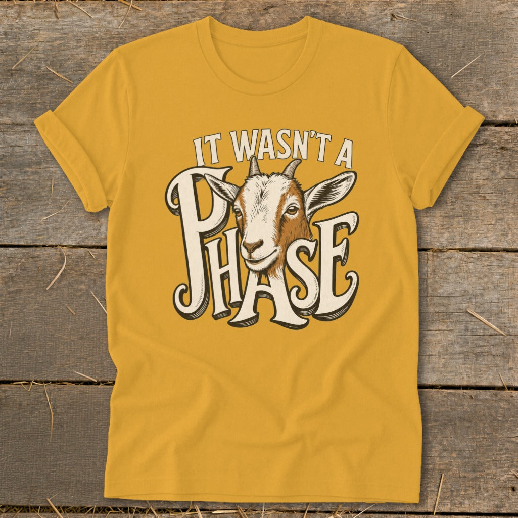 Yellow t-shirt with goat and text "IT WASN'T A PHASE".