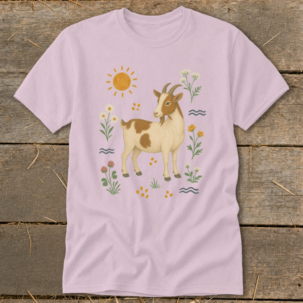 T-shirt with a brown and white goat illustration surrounded by flowers and sun.