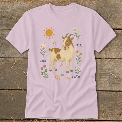 T-shirt with a brown and white goat illustration surrounded by flowers and sun.