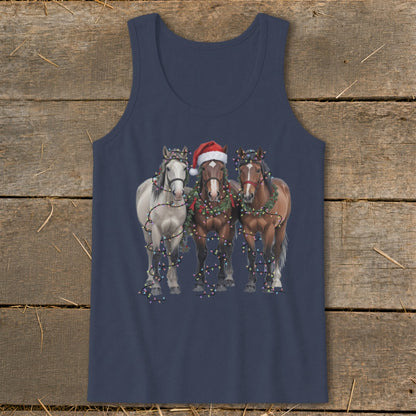 Three horses, one wearing Santa hat, are wrapped in Christmas lights.