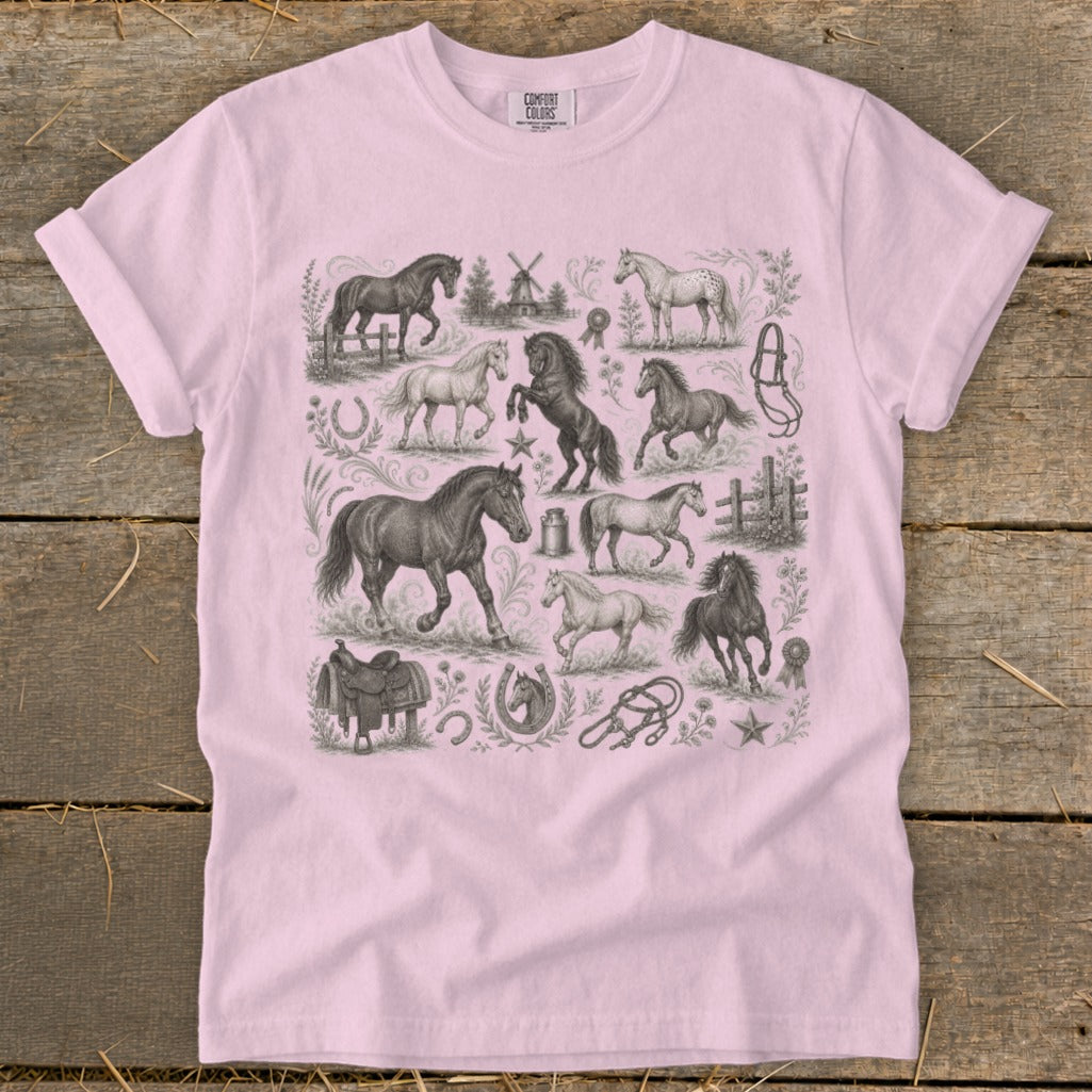 Pink t-shirt with repeated vintage sketch illustrations of horses and equestrian tack.