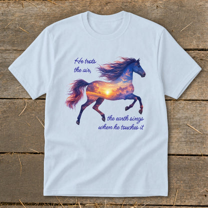 Light blue t-shirt featuring a horse graphic filled with a sunset sky and text that reads "He trots the air, the earth sings when he touches it".