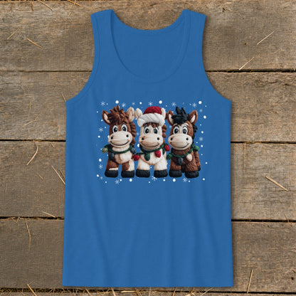 Three cartoon horses in festive attire, with snowflakes, on a blue tank top.