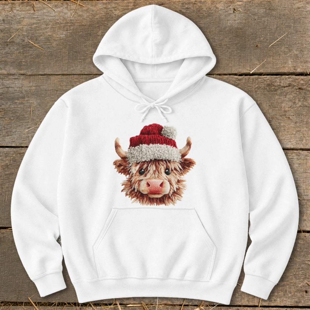 White hoodie with a Christmas highland cow graphic.