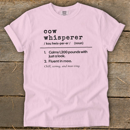 Pink t-shirt with "Cow Whisperer" definition including pronunciation and meanings.