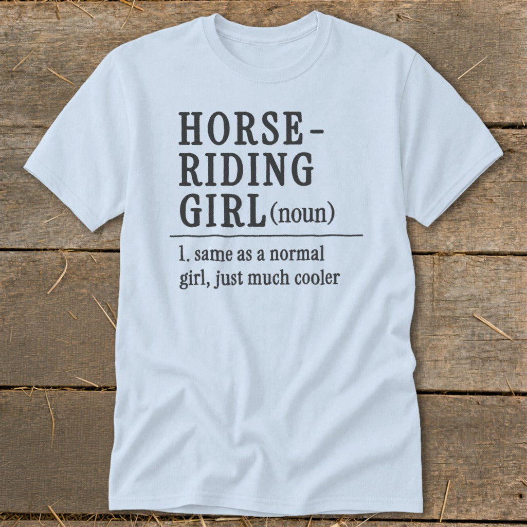 Light blue t-shirt with "Horse-Riding Girl (noun)" definition printed on it.