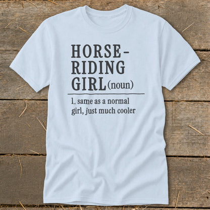 Light blue t-shirt with "Horse-Riding Girl (noun)" definition printed on it.