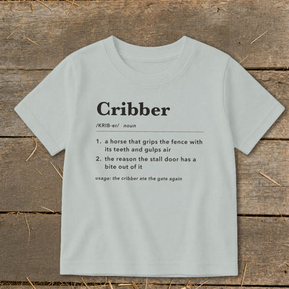 A light gray short-sleeve t-shirt with a humorous dictionary definition of cribber printed on the front.