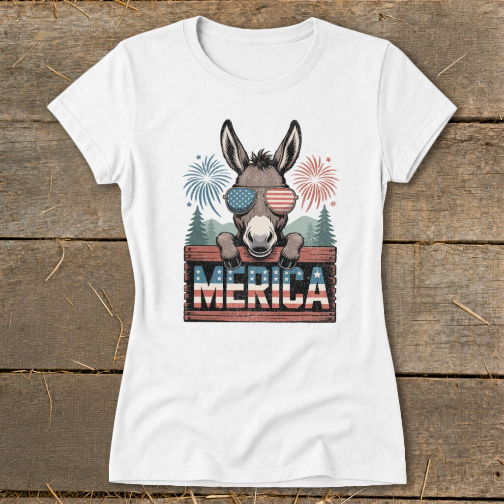 Donkey wearing American flag sunglasses behind "MERICA" sign with fireworks.