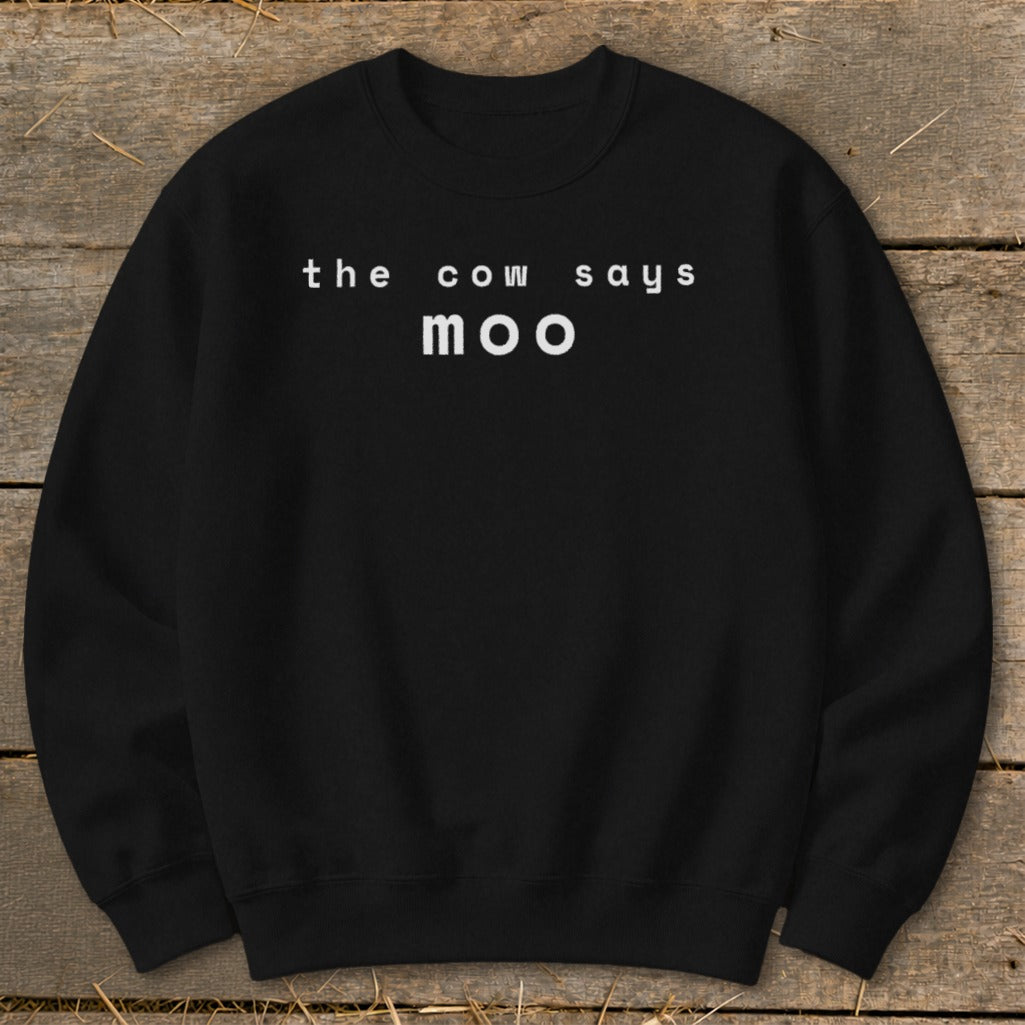 Black crewneck sweatshirt with white text "the cow says moo".