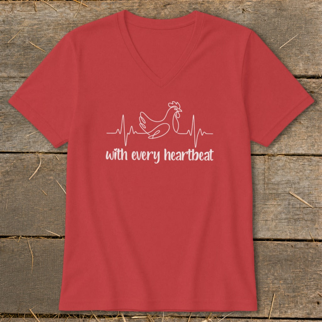 Red v-neck t-shirt with white line art of a chicken and heartbeat, and text "with every heartbeat".