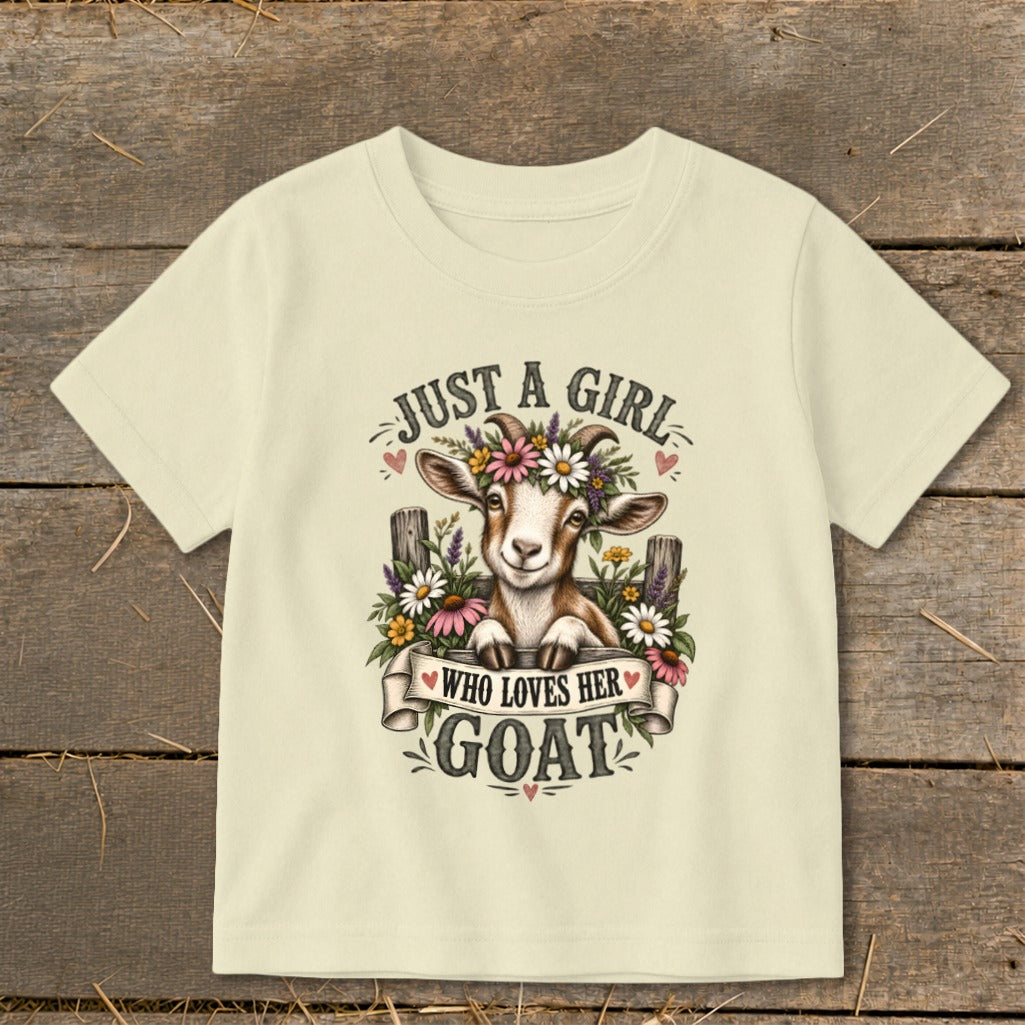 Cream t-shirt with a goat wearing a flower crown and text "JUST A GIRL WHO LOVES HER GOAT".