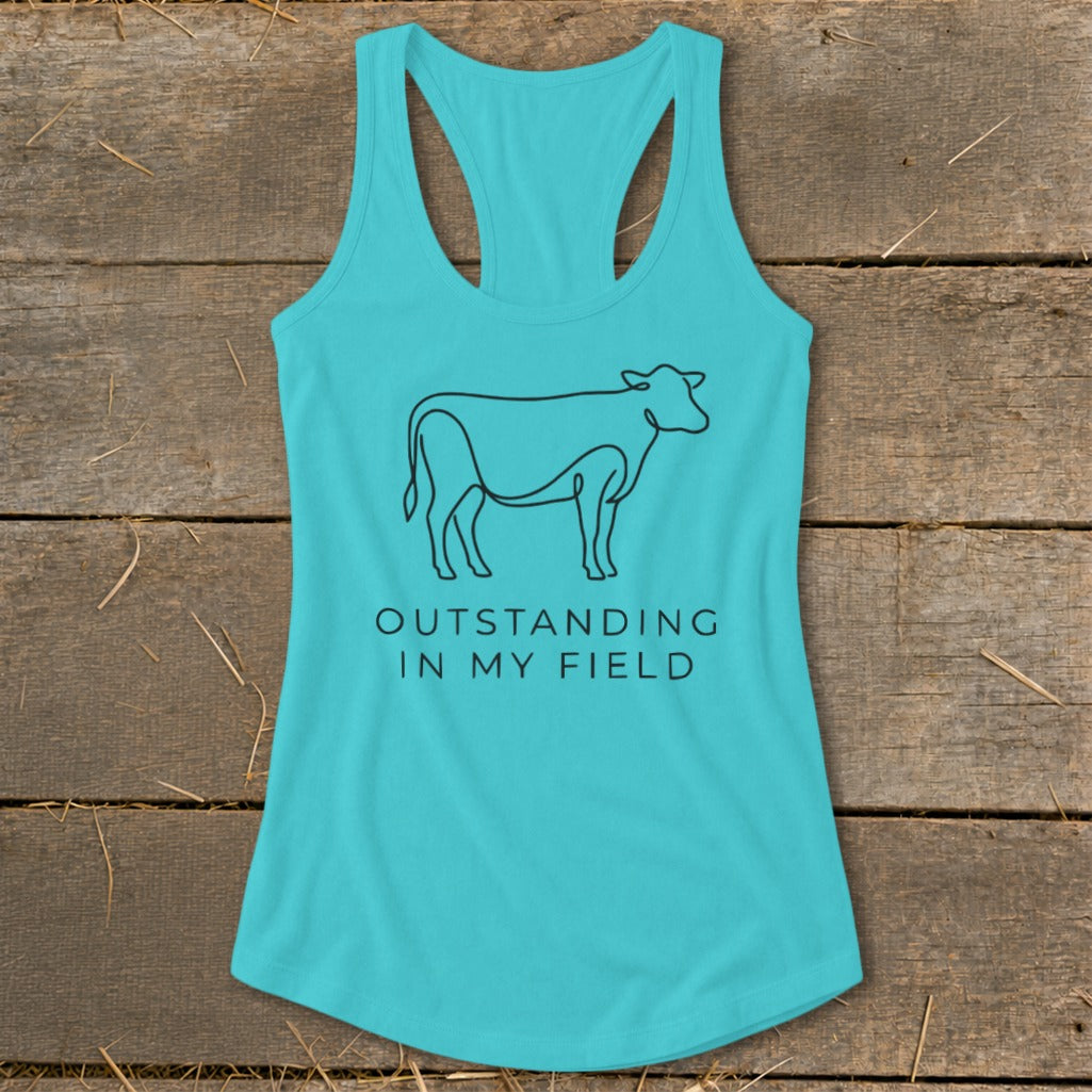 Turquoise tank top with a black line drawing of a cow and text.