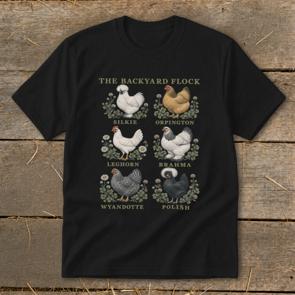 Black t-shirt with "The Backyard Flock" and illustrations of Silkie, Orpington, Leghorn, Brahma, Wyandotte, and Polish chickens.