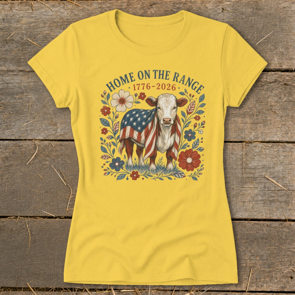 Yellow t-shirt with cow wearing American flag and "HOME ON THE RANGE 1776-2026" text.