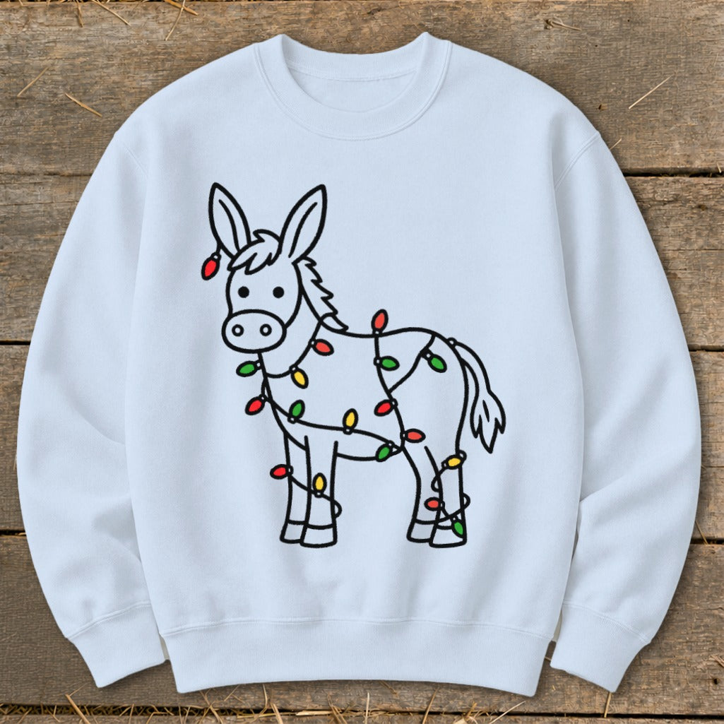 Light blue sweatshirt with a cartoon donkey wrapped in Christmas lights.