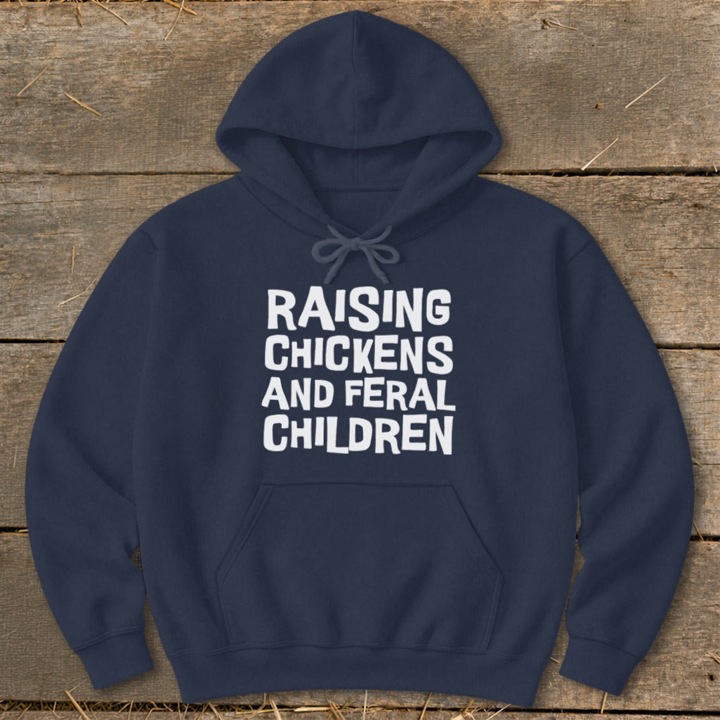 Navy hoodie with white text "Raising Chickens and Feral Children."