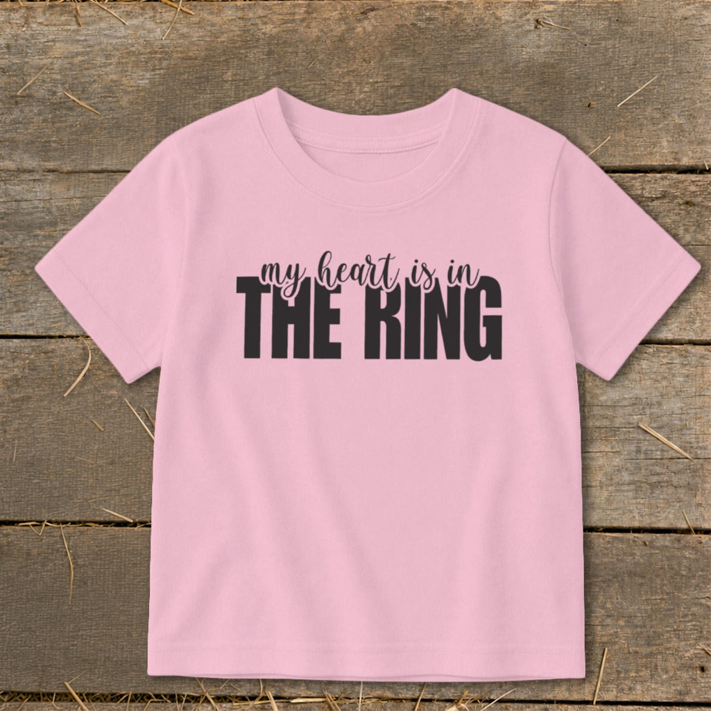 Pink t-shirt with black text "my heart is in THE RING".