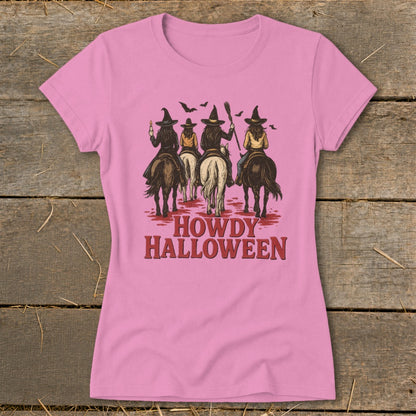 Witches on horseback with "Howdy Halloween" text.