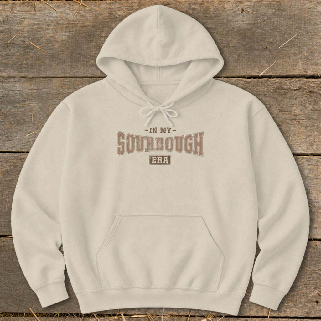 Cream hoodie with "In My Sourdough Era" text graphic on front.