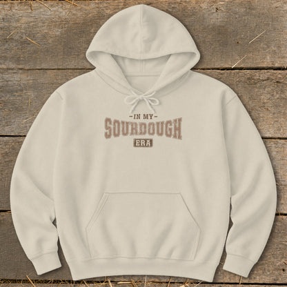 Cream hoodie with "In My Sourdough Era" text graphic on front.