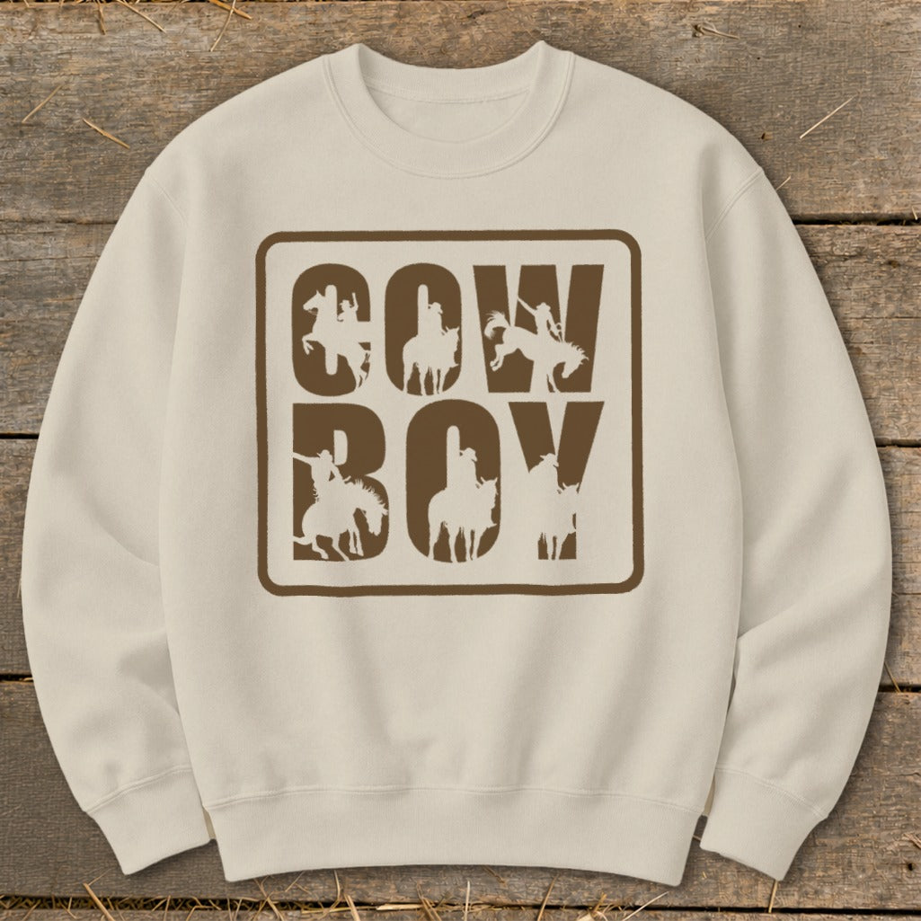 Cream sweatshirt with "COWBOY" text and cowboy silhouette graphics.