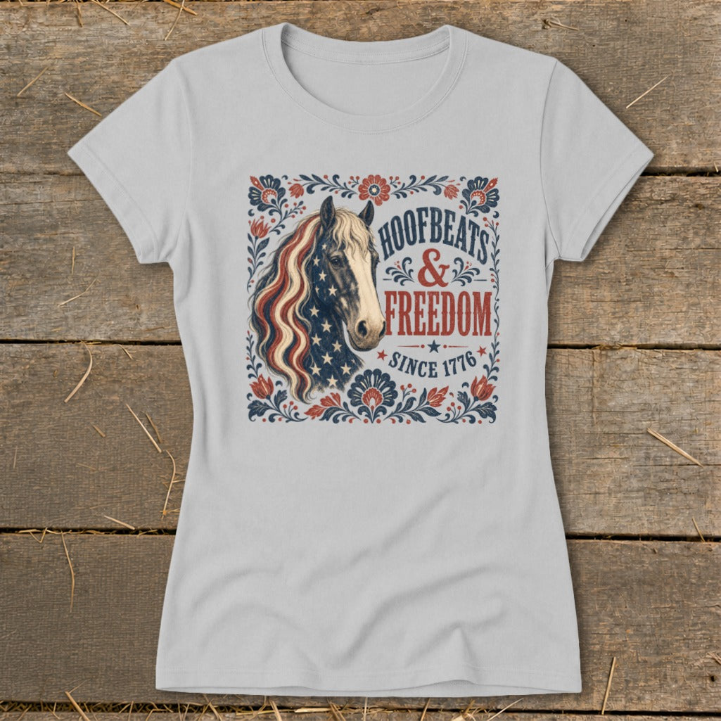 T-shirt with a horse wearing the American flag and "Hoofbeats & Freedom Since 1776" text.
