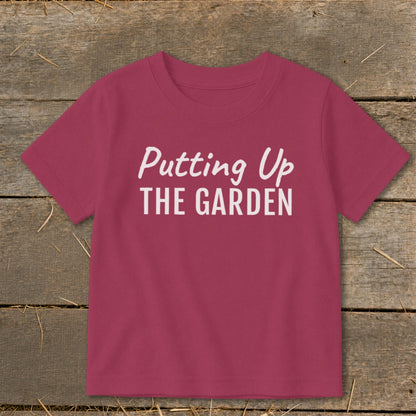 Maroon t-shirt with white text "Putting Up THE GARDEN."