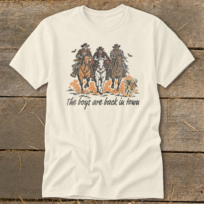 Cream t-shirt with graphic of three skeleton cowboys on horseback and running dog.