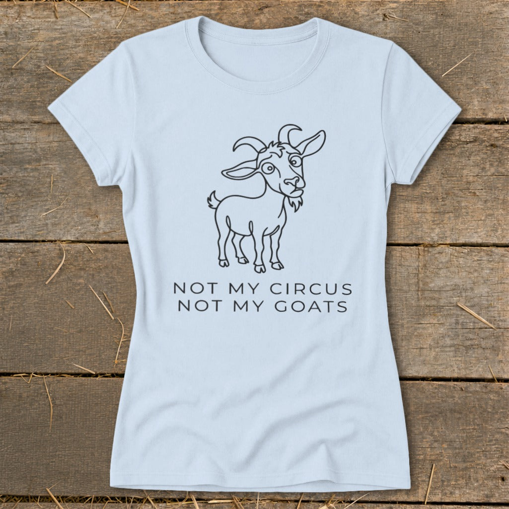 Light blue t-shirt with cartoon goat graphic and text "NOT MY CIRCUS NOT MY GOATS."