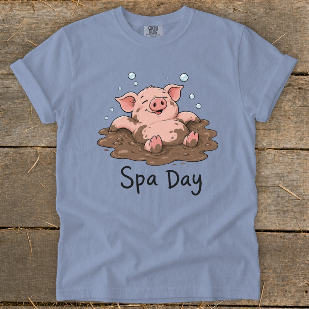 T-shirt with a happy pig enjoying a mud bath, text reads "Spa Day".