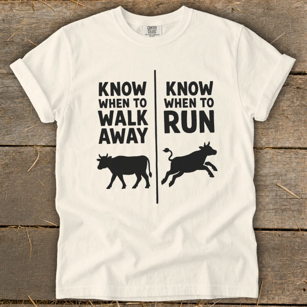 White t-shirt with "KNOW WHEN TO WALK AWAY" and "KNOW WHEN TO RUN" text.