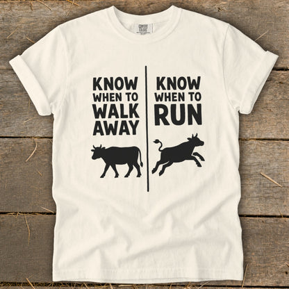 White t-shirt with "KNOW WHEN TO WALK AWAY" and "KNOW WHEN TO RUN" text.