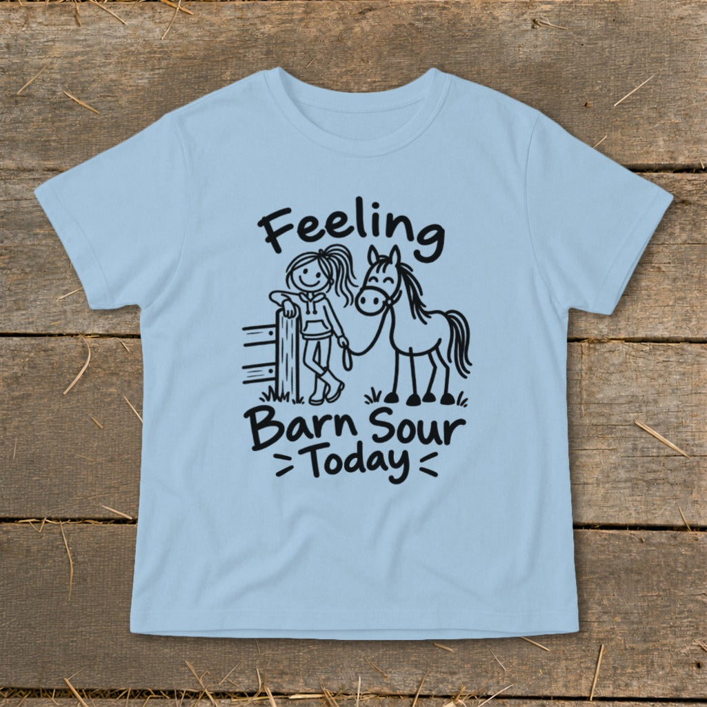 Light blue t-shirt with black text and drawing of girl and horse.