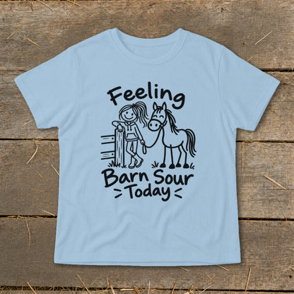 Light blue t-shirt with black text and drawing of girl and horse.