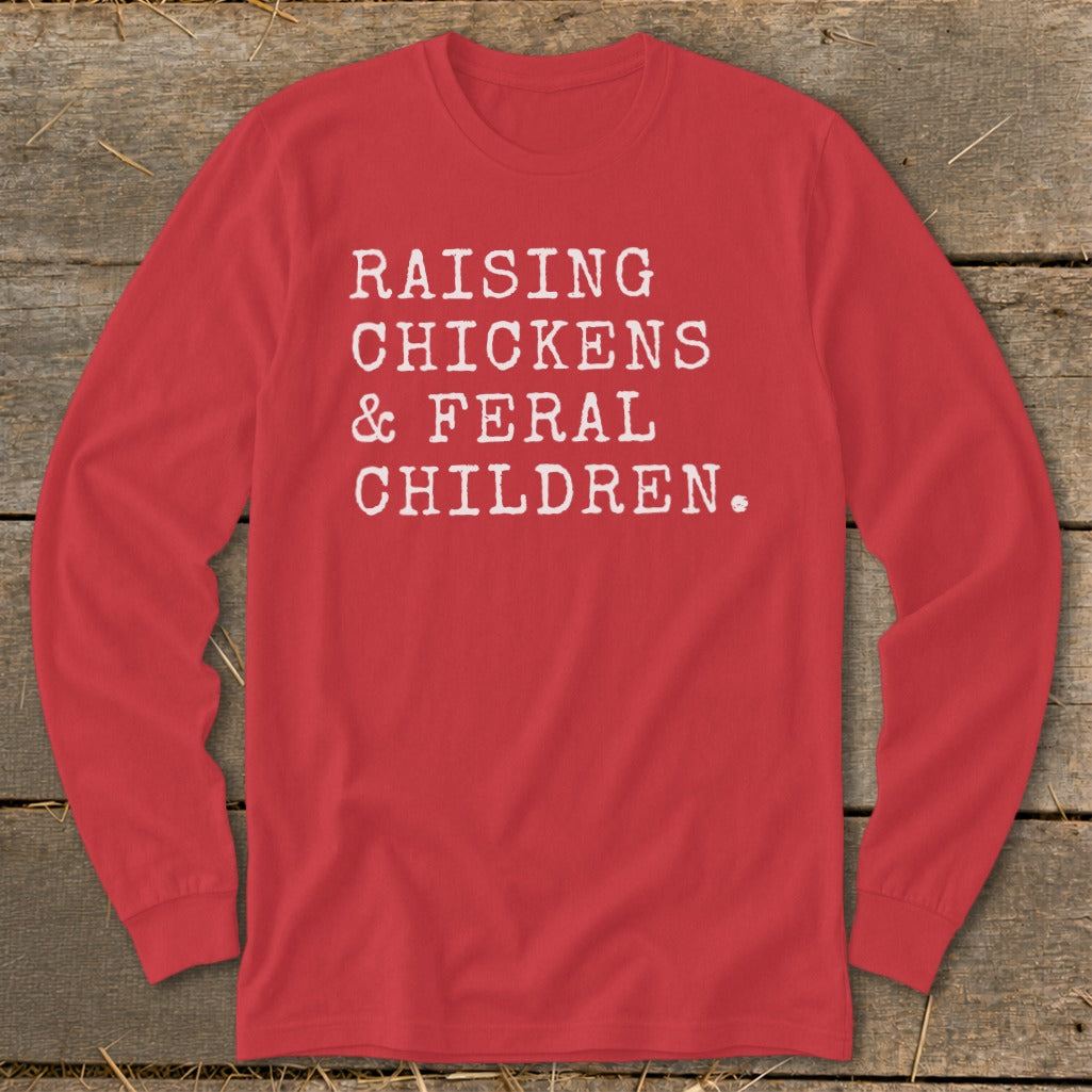 Red long sleeve shirt with white text "RAISING CHICKENS & FERAL CHILDREN."